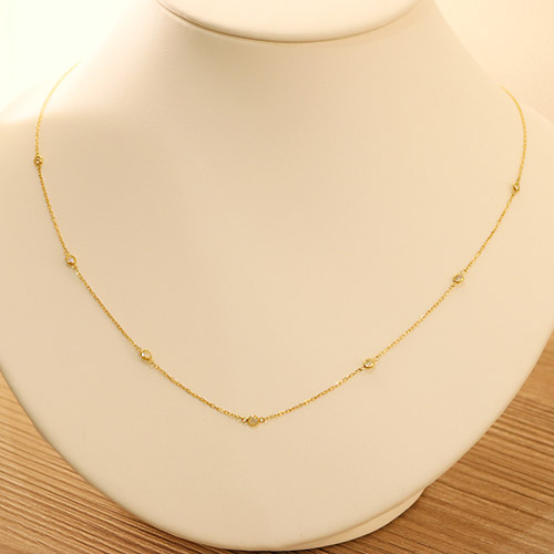 ダイヤモンド0.5ct ベゼルセット イエローゴールド ステーション